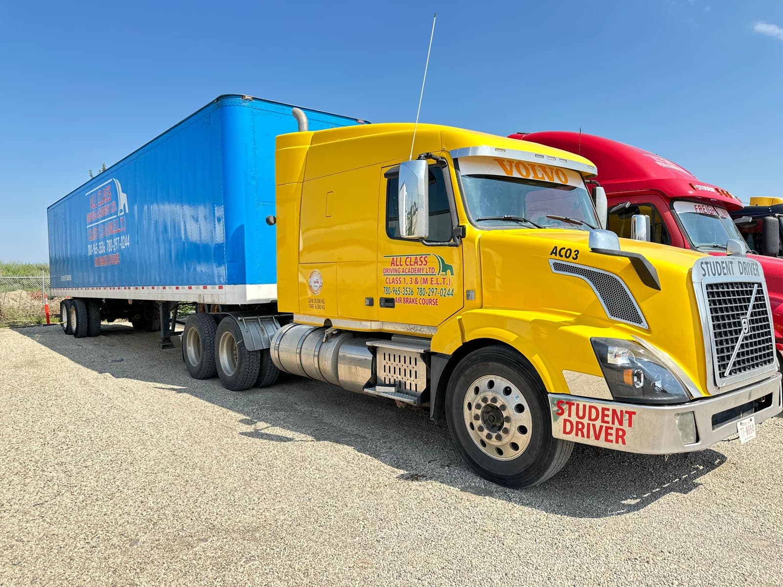 All Class Driving Academy Volvo truck and trailer parked in the yard